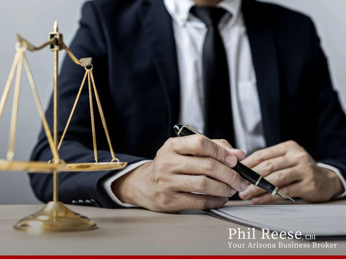 Business broker signing documents, symbolizing Selling Your Business in Arizona.
