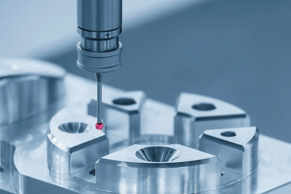 Coordinate measuring machine probe inspecting a precision-machined metal part